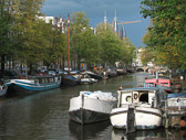 Canal boats serve as homes for many of Amsterdam's residents.