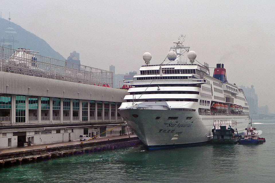 Cruise ships wait at the dock while passengers do Hong Kong shopping.