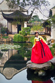 The bride poses at the Master of the Nets Dragon Gardens built over 800 yrs. ago.