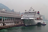 Cruise ships wait at the dock while passengers do Hong Kong shopping.