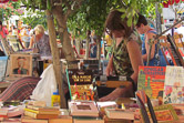 Browsing for books at the bi-weekly market in old Leucate.