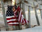 A tattered flag seen on a desolate New Jersey fisherman's beach 7 months after 9/11.